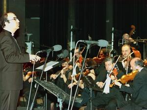 In this file photo taken on March 17, 2000, Lebanese maestro Elias Rahbani conducts his orchestra during a concert at the Casino du Liban. Lebanese media reported the death of Elias Rahbani, one of the leading pop musicians of the Arab world who is in his early 80s, after a long struggle with illness on January 4, 2021. Joseph BARRAK / AFP