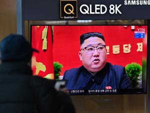 A man watches a television screen showing news footage of North Korean leader Kim Jong Un attending the 8th congress of the ruling Workers' Party held in Pyongyang, at a railway station in Seoul on January 6, 2021. Jung Yeon-je / AFP