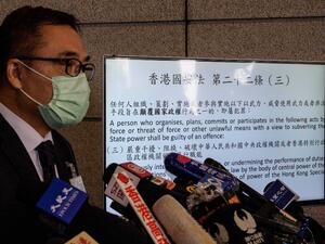 Hong Kong Police Force Senior Superintendent Steve Li Kwai-Wah speaks during a press briefing outside the Hong Kong Police Headquarters building in Hong Kong on January 6, 2021, following the arrest of dozens of opposition figures under the National Security Law. Anthony WALLACE / AFP