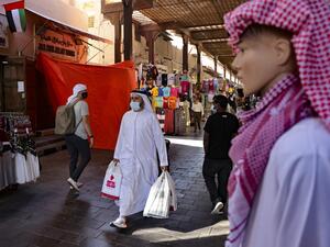 Emiratis shop at the Dubai grand market, in the Gulf city of Dubai, on January 6, 2021. Karim SAHIB / AFP
