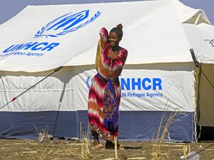 An Ethiopian refugee, who fled the Tigray conflict, walks in the Tenedba camp in Mafaza, eastern Sudan on January 8, 2021, after being transported from the reception center. ASHRAF SHAZLY / AFP