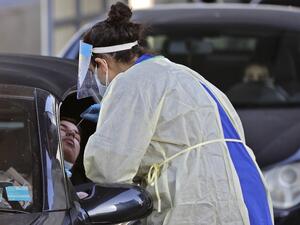 People queue in their cars in Zouk Mosbeh north of Beirut to take the COVID-19 PCR test a couple of days before a total lockdown on January 12, 2021. AFP