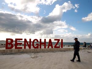 A Libyan security guard walks on the seaside promenade in the eastern Libyan coastal city of Benghazi on January 13, 2021. Libya negotiations hosted by the United Nations resumed in Geneva today. Abdullah DOMA / AFP