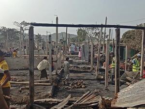 Rohingya refugees search for their belongings after a fire broke out at Nayapara refugee camp in Teknaf on January 14, 2021. AFP