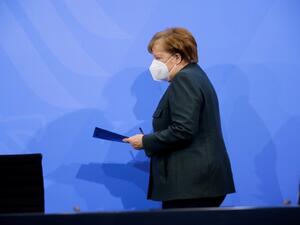 German Chancellor Angela Merkel arrives to address a press conference following talks via video conference with Germany's state premiers on the extension of the current lockdown due to the coronavirus COVID-19 pandemic, at the Chancellery in Berlin on January 19, 2021. Hannibal HANSCHKE / POOL / AFP