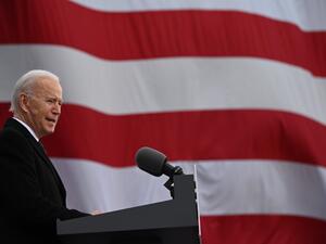 In this file photo US President-Elect Joe Biden speaks at Major Joseph R. "Beau" Biden III National Guard /Reserve Center in New Castle Airport on January 19, 2021, in New Castle, Delaware, before departing for Washington, DC. US President-elect Joe Biden plans to kick off his new administration January 20, 2021 with orders to restore the United States to the Paris climate accord and the World Health Organization, aides said. JIM WATSON / AFP