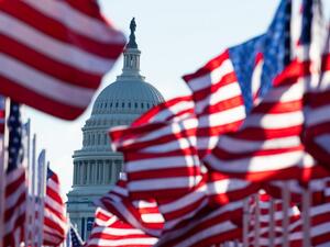US flags representing those who could not attend the inauguration due to Covid-19, flutter in the wind at the Mall before the Inauguration of US President-Elect Joe Biden in Washington, DC on January 20, 2021. ROBERTO SCHMIDT / AFP