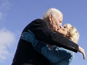 US President Joe Biden (L) kisses his wife US First Lady Jill Biden after being sworn in during his inauguration as the 46th US President on January 20, 2021, at the US Capitol in Washington, DC. Andrew Harnik / POOL / AFP