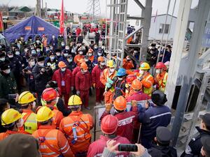 One of twenty-two Chinese miners is saved from hundreds of metres underground where they had been trapped for two weeks after a gold mine explosion in Qixia, in eastern China's Shandong province on January 24, 2021. STR / CNS / AFP