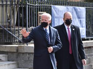US President Joe Biden(C) leaves Holy Trinity Catholic Church in the Georgetown neighborhood of Washington,DC on January 24, 2021. Joe Biden has begun his presidency with sharp breaks from Donald Trump in both substance and tone, from climate change to immigration to a general openness to working with the rest of the world. Nicholas Kamm / AFP