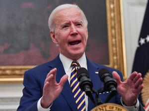 In this file photo US President Joe Biden speaks about the Covid-19 response before signing executive orders for economic relief to Covid-hit families and businesses in the State Dining Room of the White House in Washington, DC, on January 22, 2021. President Joe Biden will sign an executive order on January 25, 2021 giving priority to US companies and products in contracts with the federal government, pushing a "Made in America" approach favored by predecessor Donald Trump.The order, senior White House off
