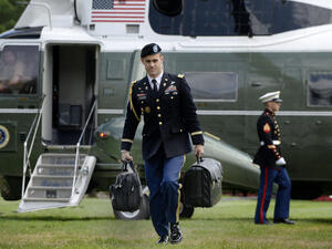 A military aide carries the president's nuclear "football" as President Barack Obama returns to the White House in Washington, DC on May 14, 2016.Olivier Douliery / AFP - Getty Images, file