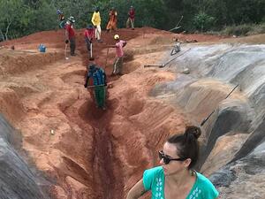 The scarlet sculpture, titled 'Diva', stretches for 33 metres and was built into the hillside with the help of diggers. Visual artist Juliana Notari is pictured above. (Instagram)