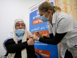 Pictured: A woman gets vaccinated against the COVID-19 coronavirus in the Israeli-annexed Golan Heights. (AFP)