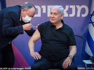 Israeli Prime Minister Benjamin Netanyahu, pictured being given the vaccine on 9 January, pledged to vaccinate every citizen by the end of March. (AFP)