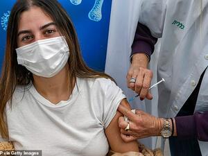 Or, an 18-year-old teenager, receives a dose of the Pfizer-BioNtech COVID-19 coronavirus vaccine at Clalit Health Services, in Israel's Mediterranean coastal city of Tel Aviv, January 23. AFP