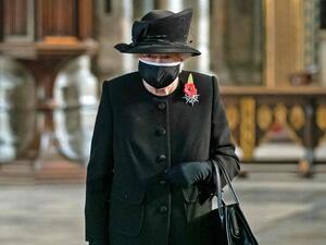 Queen Elizabeth II looks at the grave of the Unknown Warrior at Westminster Abbey during a service to mark the centenary of his burial ahead of Remembrance Sunday. AFP 