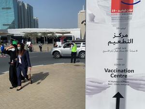 People arrive to a designated COVID-19 vaccination center at Dubai's financial center district, in the United Arab Emirates, on January 24, 2021. The emirate of Dubai has said it was slowing down its rollout of the Pfizer-BioNTech coronavirus vaccine due to a temporary delay in global deliveries. Giuseppe CACACE / AFP