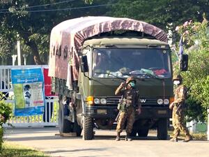 This screengrab taken from AFPTV video footage shows soldiers at the entrance to a guesthouse, where members of parliament reside at, in the country's capital Naypyidaw on February 2, 2021, as Myanmar's generals appeared in firm control a day after a surgical coup that saw democracy heroine Aung San Suu Kyi detained. STR / AFPTV / AFP