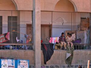 Boys sit together inside a school building for displaced Yemenis who fled fighting between Huthi rebels and the Saudi-backed government forces, in the town of al-Turba in Taez governorate on February 4, 2021. AHMAD AL-BASHA / AFP