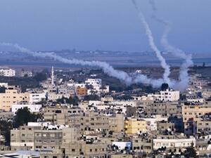  In this file photo taken on August 21, 2014 smoke trails mark the path of Palestinian missiles fired from the north-east of Gaza City. The International Criminal Court's ruling that it has jurisdiction over events in the Palestinian territories opens the way to an investigation of alleged war crimes committed in the 2014 Israeli-Palestinian conflict in Gaza. The 50-day war, which devastated the coastal enclave and left 2,251 dead on the Palestinian side, mostly civilians, and 74 on the Israeli side, mostly