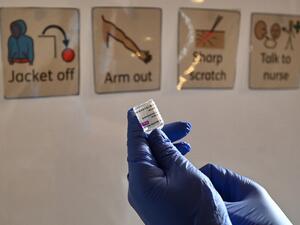A health worker prepares a dose of the AstraZeneca/Oxford Covid-19 vaccine at a temporary vaccine centre set up at City Hall in Hull, northeast England on February 10, 2021. Paul ELLIS / AFP