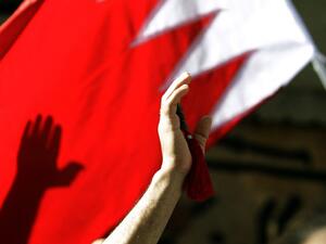  In this file photo taken on March 22, 2011 Bahraini Shiite wave a Bahrain flag as they attend the funerals of a man in central Manama. With a popular, reform-minded crown prince newly installed as prime minister, and a decade passed since the Arab Spring, Bahrain should be well placed to cast off the painful legacy of its uprising. The Pearl monument in downtown Manama -- the centre of the protests before they were crushed with the help of Saudi forces -- has long since been razed. But the nation's wounds 