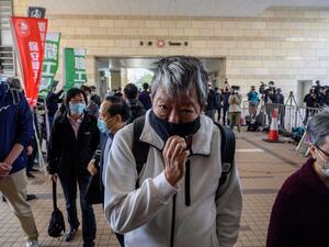 Hong Kong pro-democracy activists Lee Cheuk-yan (front C), Albert Ho, (behind centre L) and Cyd Ho (R) enter the West Kowloon Magistrates Court in Hong Kong on February 16, 2021, as veteran activists go on trial for organising one of the biggest democracy protests to sweep the city in 2019. Anthony WALLACE / AFP