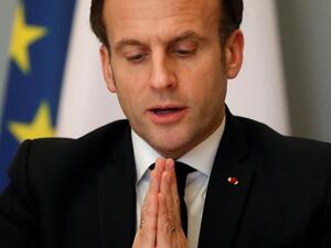 French President Emmanuel Macron gestures as he speaks during a video conference meeting with African Union officials following the ACT-A initiative to coordinate a global and united response to the Covid-19 pandemic, at the Elysee Palace in Paris, on February 17, 2021. GONZALO FUENTES / POOL / AFP
