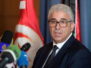  In this file photo taken on December 26, 2019 Fathi Bashagha, Libya's UN-recognised and Tripoli-based Government of National Accord (GNA) interior minister, gives a press conference in the Tunisian capital Tunis. The powerful interior minister of Libya's unity government survived an assassination attempt on February 21, 2021 on a highway near the capital Tripoli, an official from his inner circle told AFP. FETHI BELAID / AFP