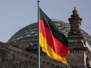 The German flag flys outside the Reichstag, the building which houses the Bundestag (the German lower house of parliament) on February 24, 2021 in Berlin. David GANNON / AFP
