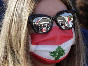 A Lebanese protester waits for the speech of Lebanon's Cardinal Mar Bechara Boutros al-Rahi (or Rai) on February 27, 2021 at the Maronite Patriarchate in the mountain village of Bkerki, northeast of Beirut. Thousands rallied Saturday in Bkerke north of Beirut, carrying Lebanese flags and portraits of Patriarch Bechara al-Rahi at the seat of the patriarchate. Earlier this month, Rahi had called for a UN-sponsored "international conference" in the face of the country's economic collapse and political impasse.
