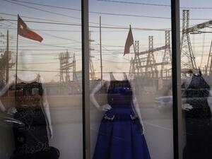 An electrical substation is reflected in the window of a dress shop on February 21, 2021 in Houston, Texas. Millions of Texans lost their power when winter storm Uri hit the state and knocked out coal, natural gas and nuclear plants that were unprepared for the freezing temperatures brought on by the storm. Wind turbines that provide an estimated 24 percent of energy to the state became inoperable when they froze. Justin Sullivan/Getty Images/AFP JUSTIN SULLIVAN / GETTY IMAGES NORTH AMERICA / Getty Images v