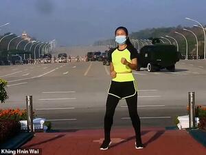 Khing Hnin Wai, a PE teacher from Myanmar's capital Naypyidaw, was recording a workout video in front of the country's parliament on Monday when a coup took place behind her. (Facebook)