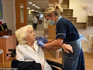 A UK care home resident receives a dose of the AstraZeneca vaccine last month, with Britain among the world leaders in the vaccine race so far. (AFP)