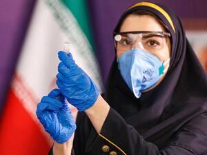 A health worker prepares an injection during the first trial phase of a locally made Iranian vaccine against COVID-19 in Iran's capital Tehran on Dec. 29, 2020. Photo by AFP via Getty Images  