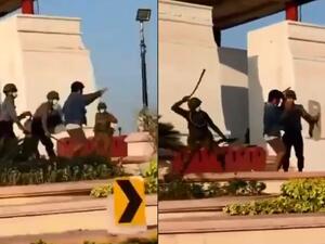 Myanmar military men beating up a civilian for participating in the national-wide protests. (Twitter/ Video Screenshot)