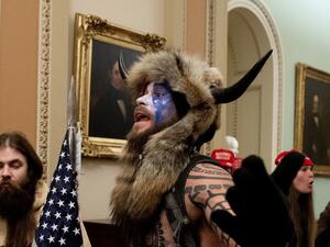 The Justice Department announced Saturday that it had charged the man known as the "QAnon shaman," Jacob Anthony Chansley, in connection with the Capitol break-in on Wednesday. Saul Loeb/AFP via Getty Images