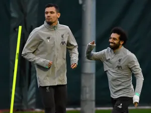The Egyptian forward has generated exit rumours at Anfield, but a former team-mate and close friend can see him sticking around (Photo: AFP)