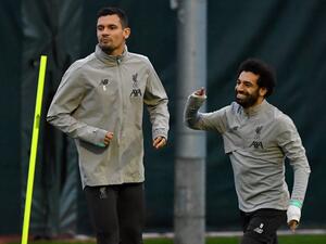 The Egyptian forward has generated exit rumours at Anfield, but a former team-mate and close friend can see him sticking around (Photo: AFP)