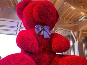 A 20-foot-2-inch tall bear made from 18,000 roses attached to a metal frame broke a Guinness World Record. (Photo courtesy of Guinness World Records)
