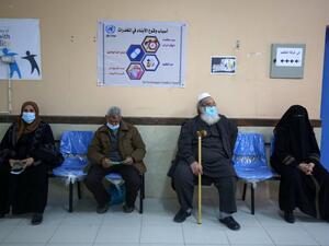 People wait to receive the Sputnik V COVID-19 vaccine at the United Nations Relief and Works Agency for Palestine Refugees (UNRWA) clininc in the Rafah camp for Palestinian refugees in the southern Gaza Strip