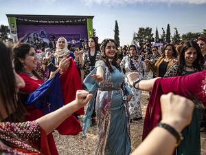Kurdish Syrian women take part in Women's Day celebration in the Syria's northeastern city of Qamishli