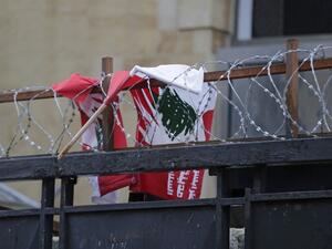 The Lebanese flag tangled in barbed wire 