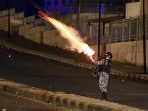 Jordanian security forces disperse a protest in Amman