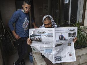 Palestinian follows the Israeli elections