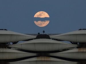  a view of the rising full "Worm Moon" above Basra International Stadium in the southern Iraqi city