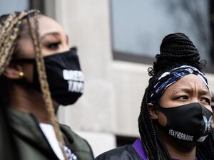 Tamika Mallory (L) speaks as Tamika Palmer listens