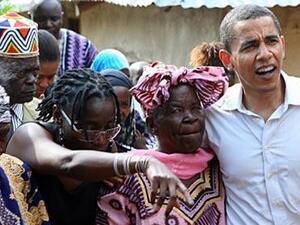 The then Senator Barack Obama holds his step-grandmother Sarah Hussein Onyango Obama