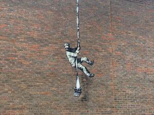 Banksy on a prison wall (Twitter)